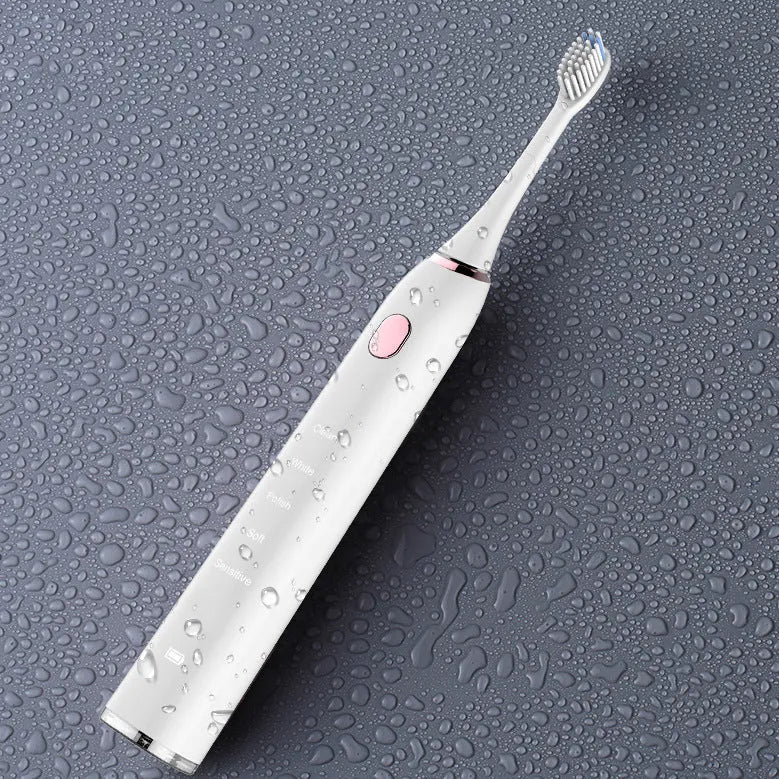 White waterproof electric toothbrush with inductive charging base and five nursing mode buttons