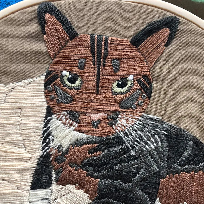 Cat themed DIY cross stitch kit for beginners with embroidery hoop and materials for 3D design.