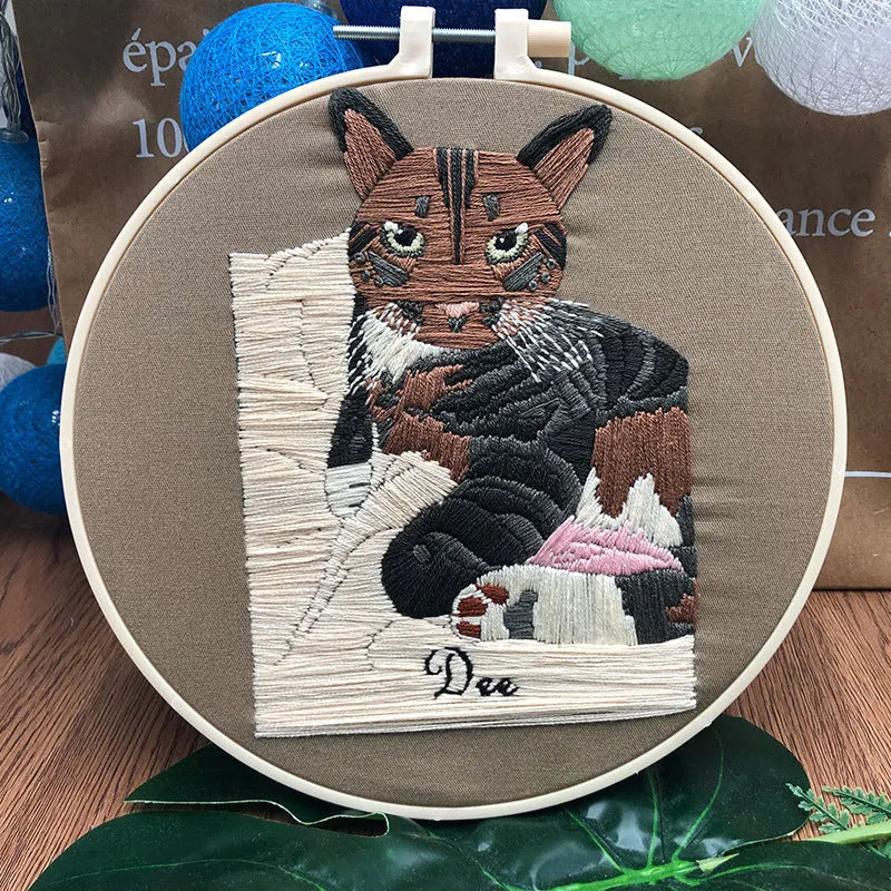Cat themed DIY cross stitch kit for beginners with embroidery hoop and materials for 3D design.