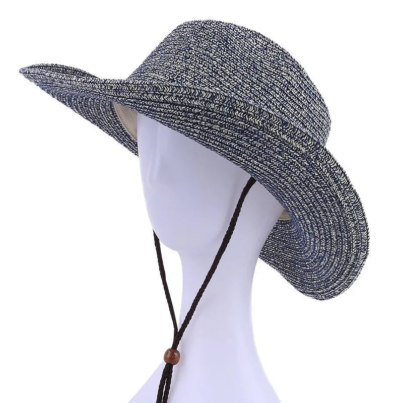 Unisex papyrus wide brim sun hat with adjustable chin strap wind lanyard, in brown, on neutral background