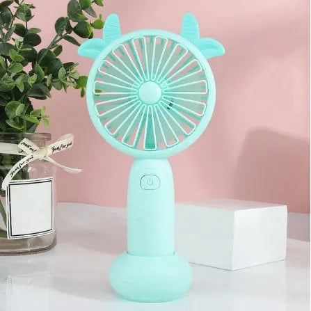 Small blue cartoon-style handheld USB rechargeable mini fan with plastic blades.