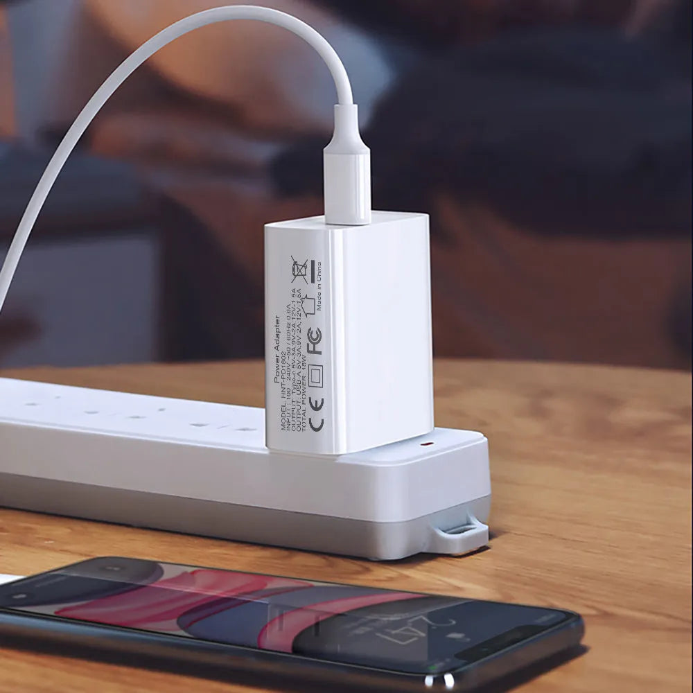 White 18W USB PD fast wall charger with dual ports and a choice of US, UK, or EU plug
