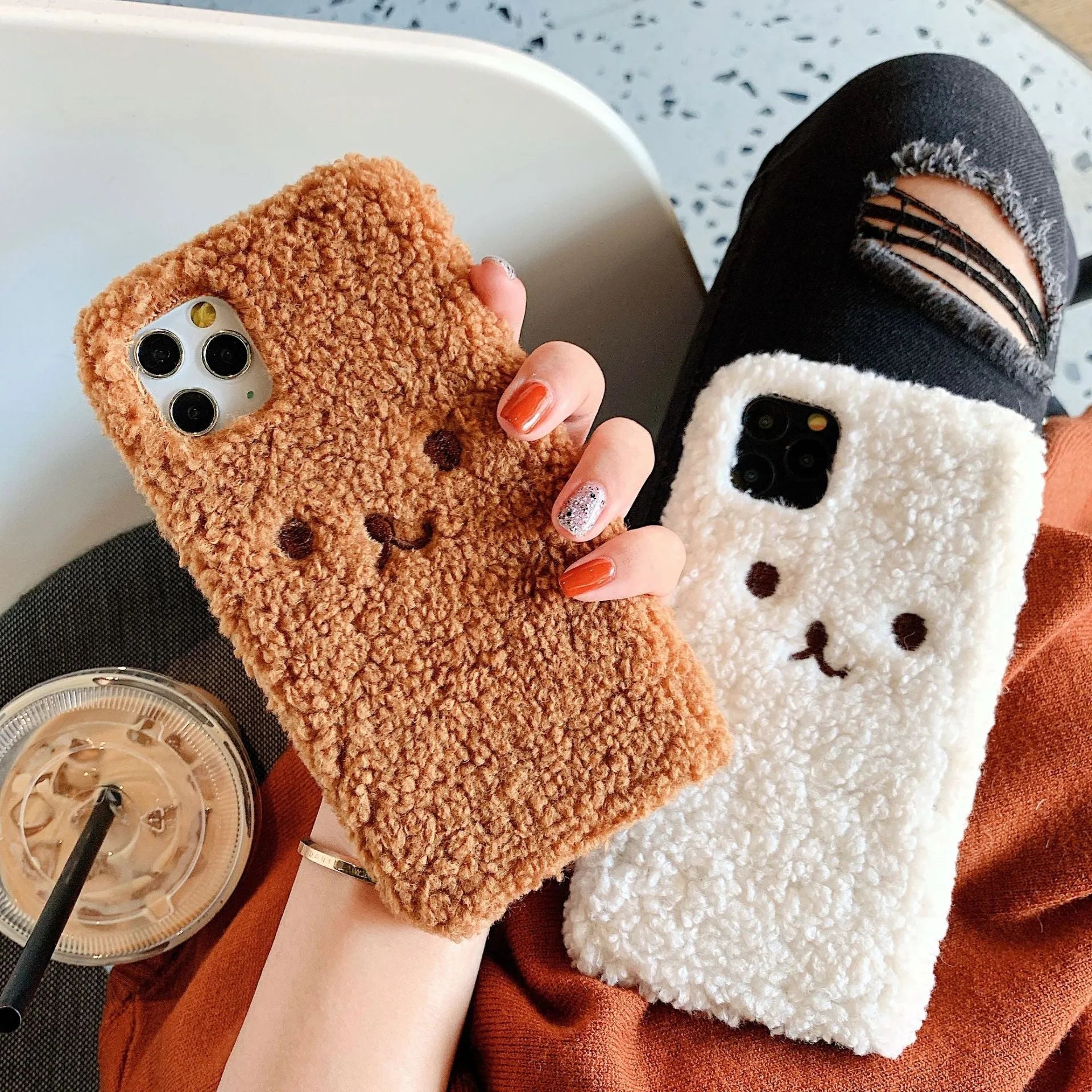 Brown and white embroidered plush bear face cartoon design on a soft TPU iPhone phone case.