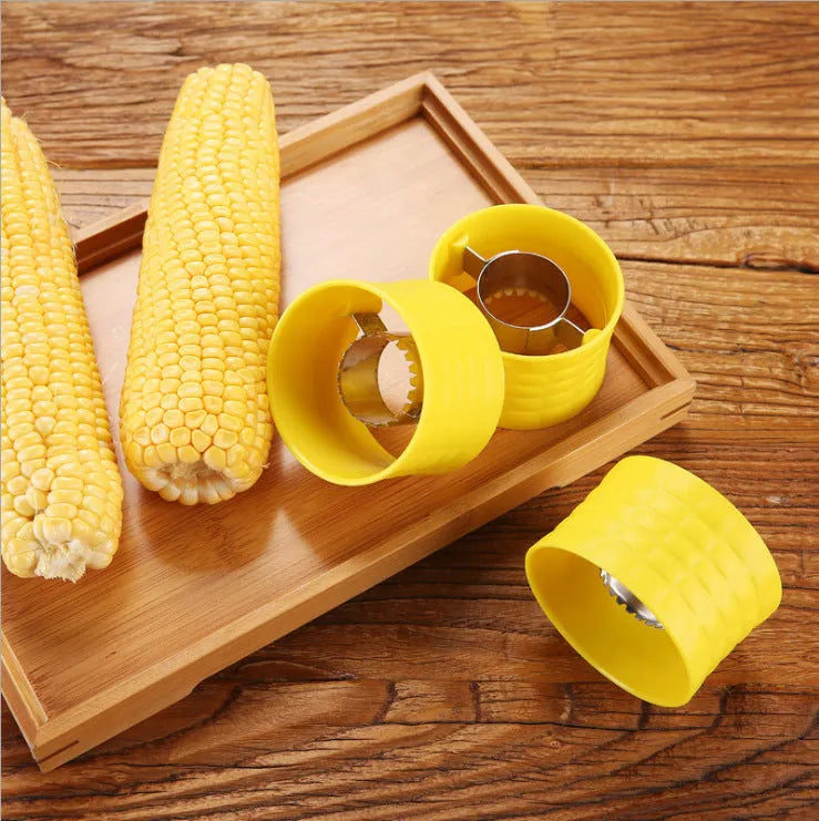 Yellow corn-shaped manual thresher kitchen tool with a non-slip PP grip for removing kernels from corn cobs.