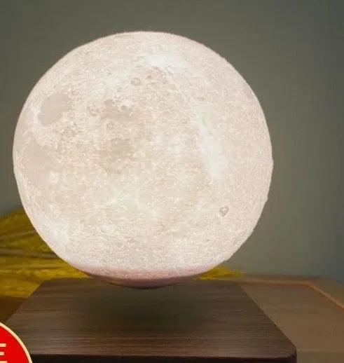 Magnetic levitation moon night light with 14cm 3D-printed planet suspended above a dark peach wood base