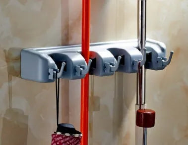 Plastic mop hook wall hanger with 4 hooks for drilling installation, holding a mop and broom
