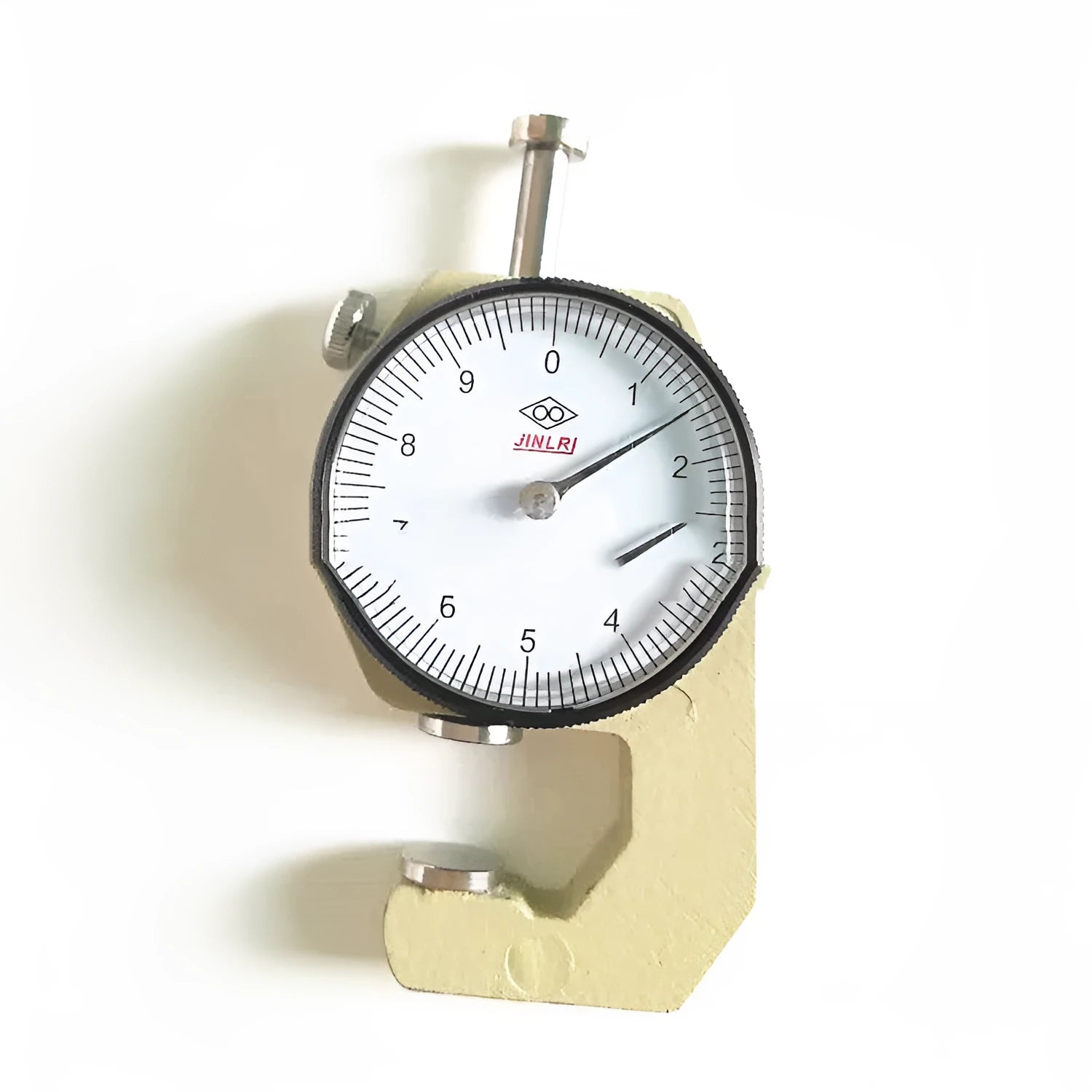 Digital thickness gauge tool showing measurement ranges for steel, plastic, cloth and paint.