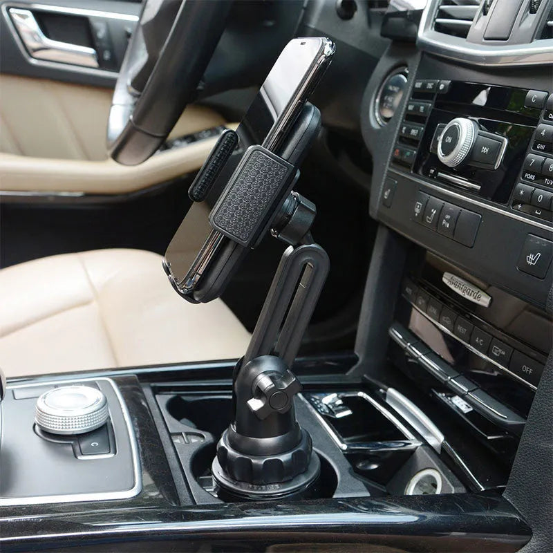 Black ABS plastic car phone holder with 360-degree rotating head and adjustable arm on a car dashboard.