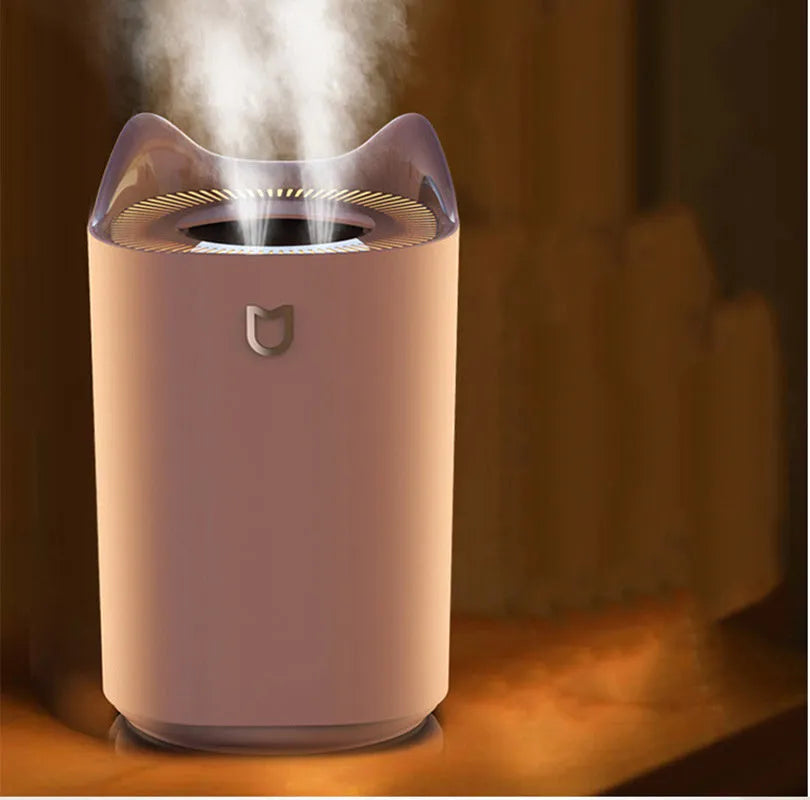 Coral pink and glacier white double spray humidifier with three mist outlets and USB cable