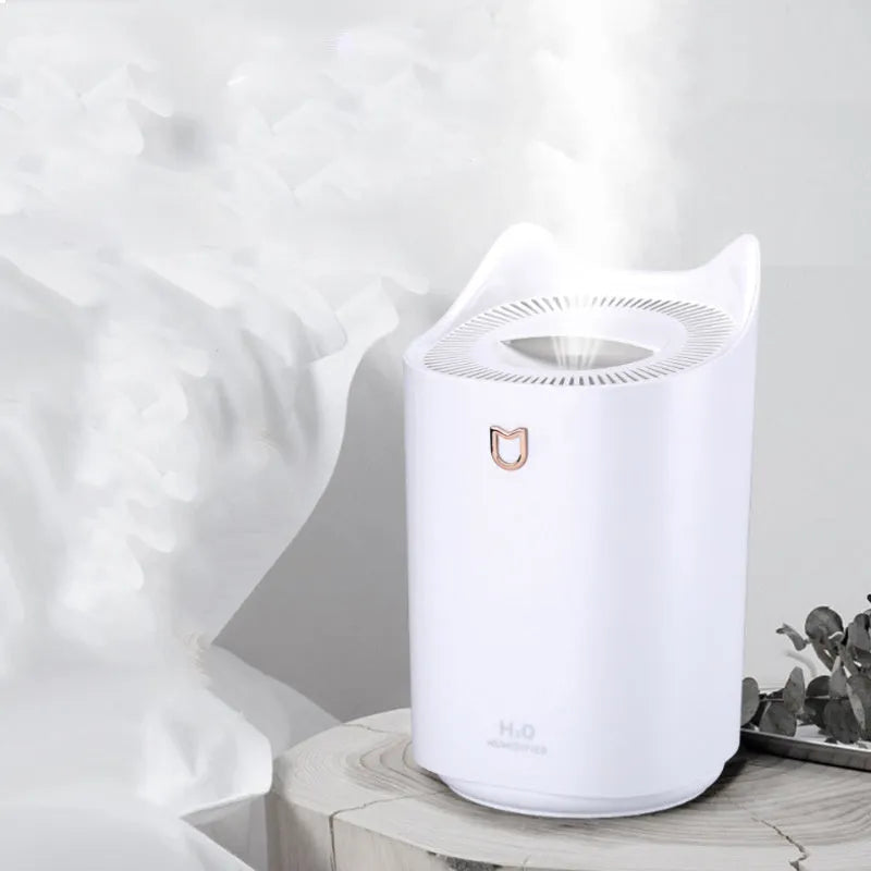 Coral pink and glacier white double spray humidifier with three mist outlets and USB cable