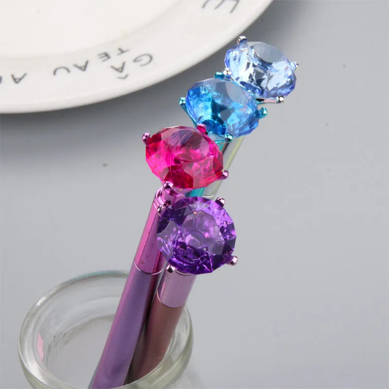 Metallic diamond tip gel pen with black ink, 17cm plastic shell, shown in purple, silver, blue, and pink colour options.