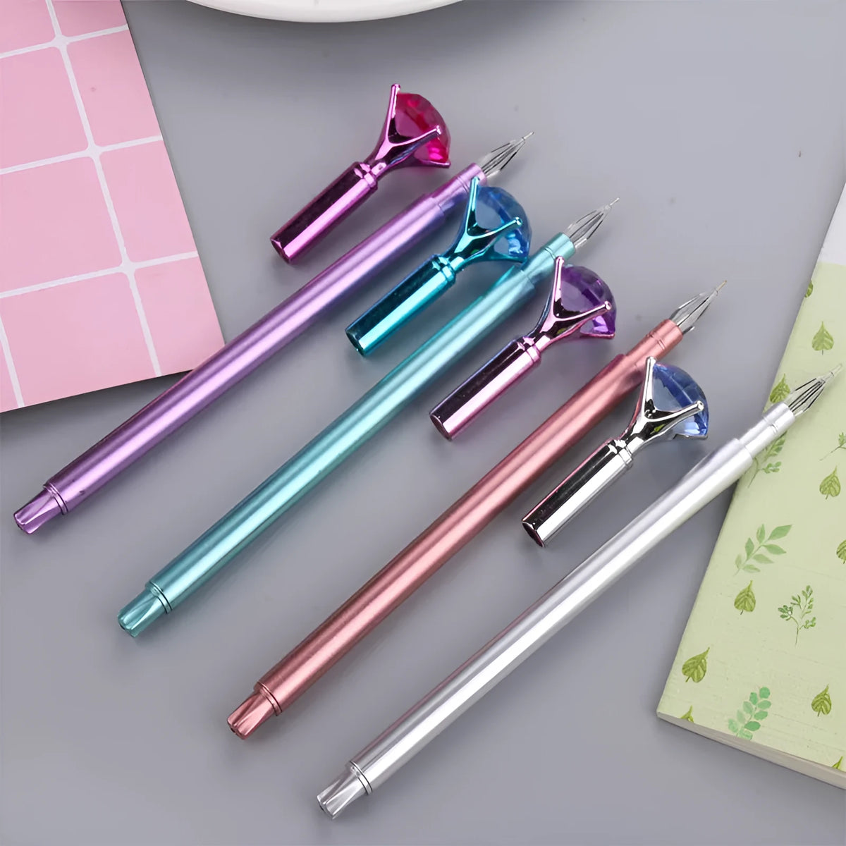 Metallic diamond tip gel pen with black ink, 17cm plastic shell, shown in purple, silver, blue, and pink colour options.