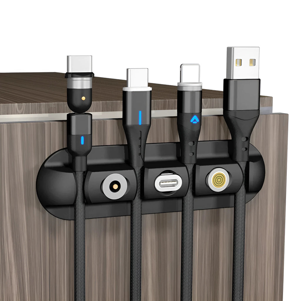 Black soft plastic desktop charging cable organiser with magnetic data cable holders