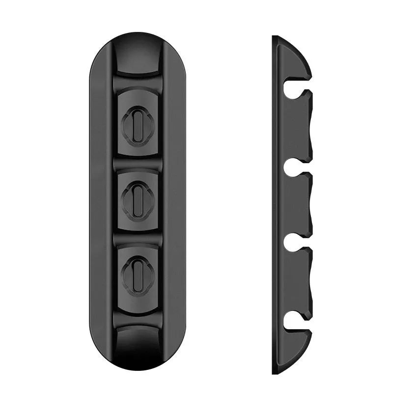 Black soft plastic desktop charging cable organiser with magnetic data cable holders