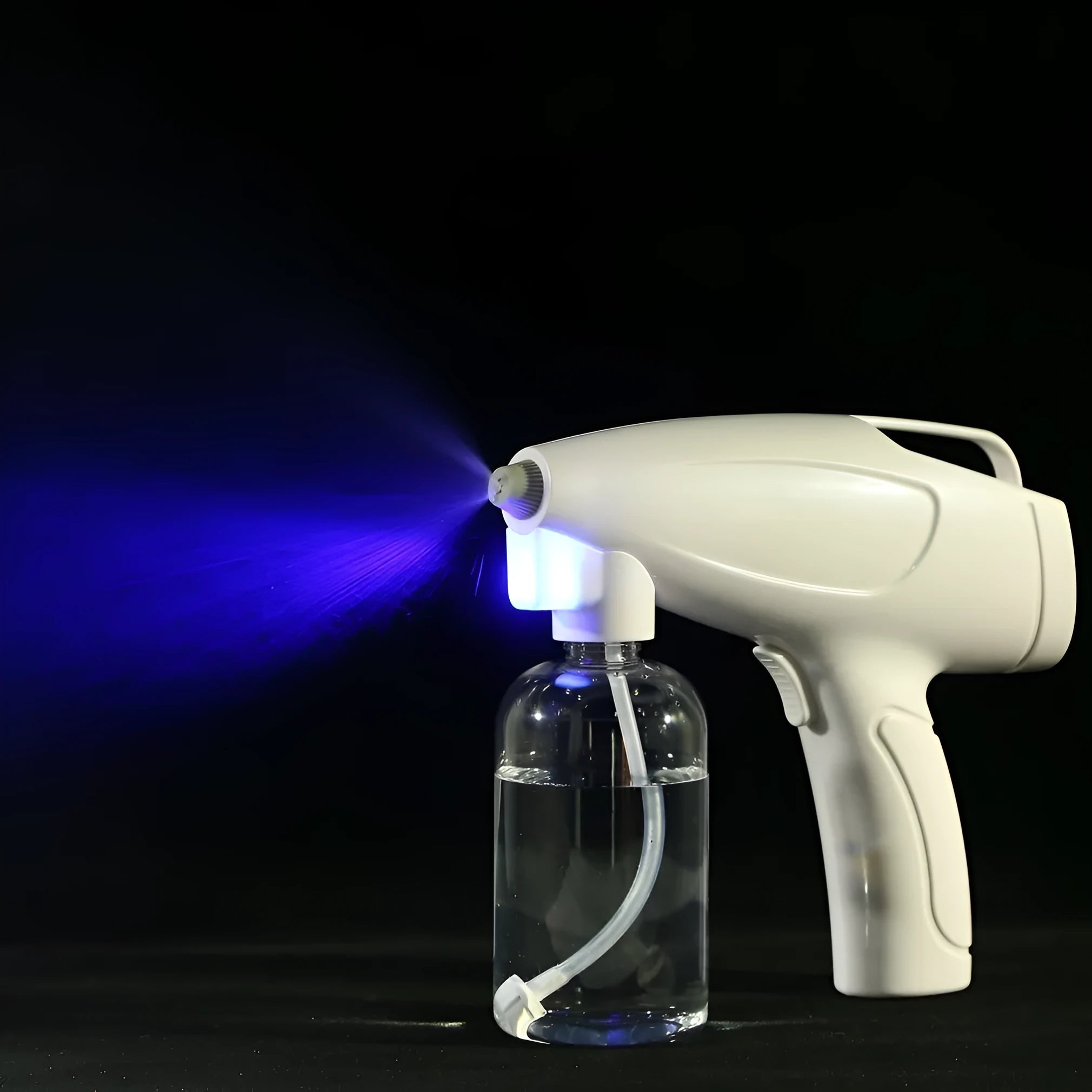 White cordless electric spray disinfection gun with USB-C charging port and bottle.