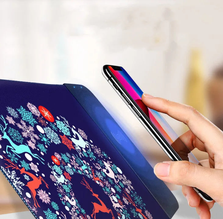 Wireless charging mouse pad with RGB lighting and cartoon design on black background