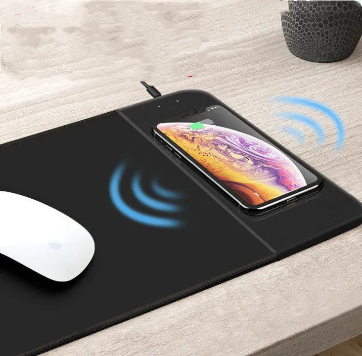Wireless charging mouse pad with RGB lighting and cartoon design on black background