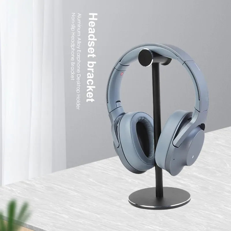 Black aluminium alloy headset bracket on desk holding a headphone for storage