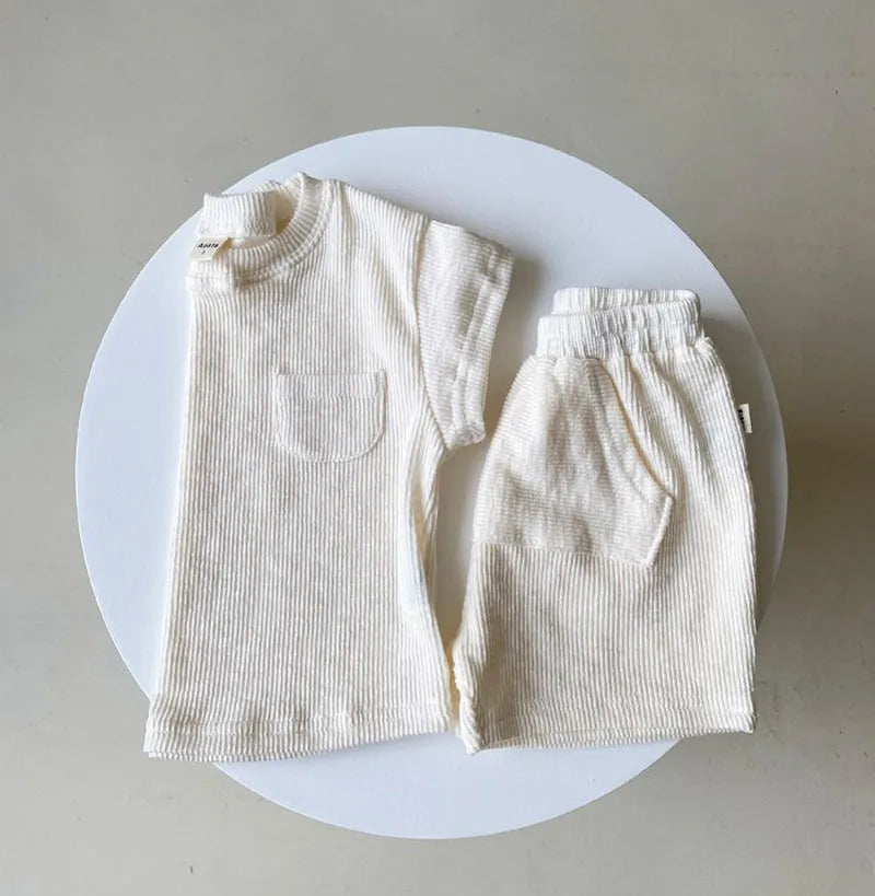 Solid colour cotton baby romper with short sleeves and loose fit for summer, unisex triangle climbing style