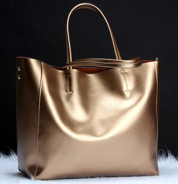 Women's cowhide leather shoulder handbag in bronze colour showing dimensions and detachable strap