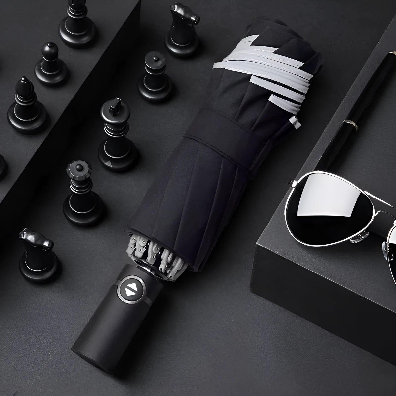 Automatic reverse umbrella showing black canopy with 10 ribs and plastic non-slip handle