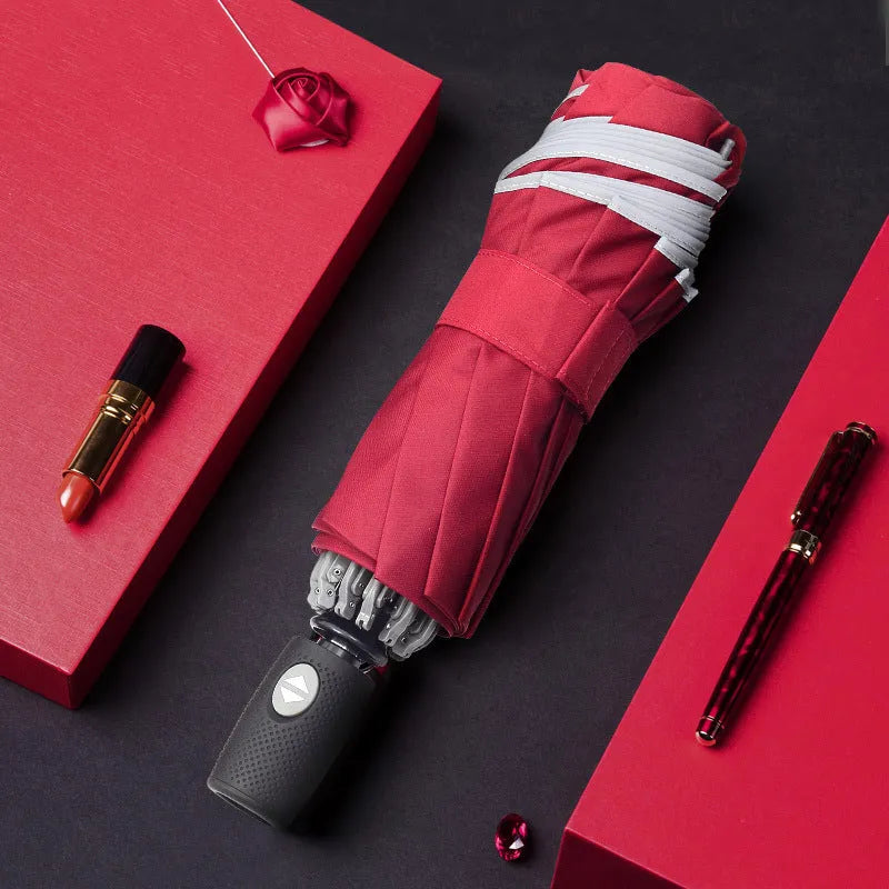 Automatic reverse umbrella showing black canopy with 10 ribs and plastic non-slip handle