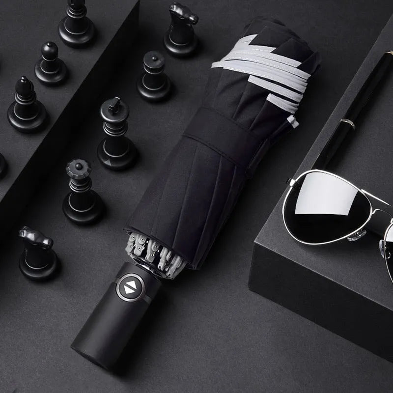 Automatic reverse umbrella showing black canopy with 10 ribs and plastic non-slip handle