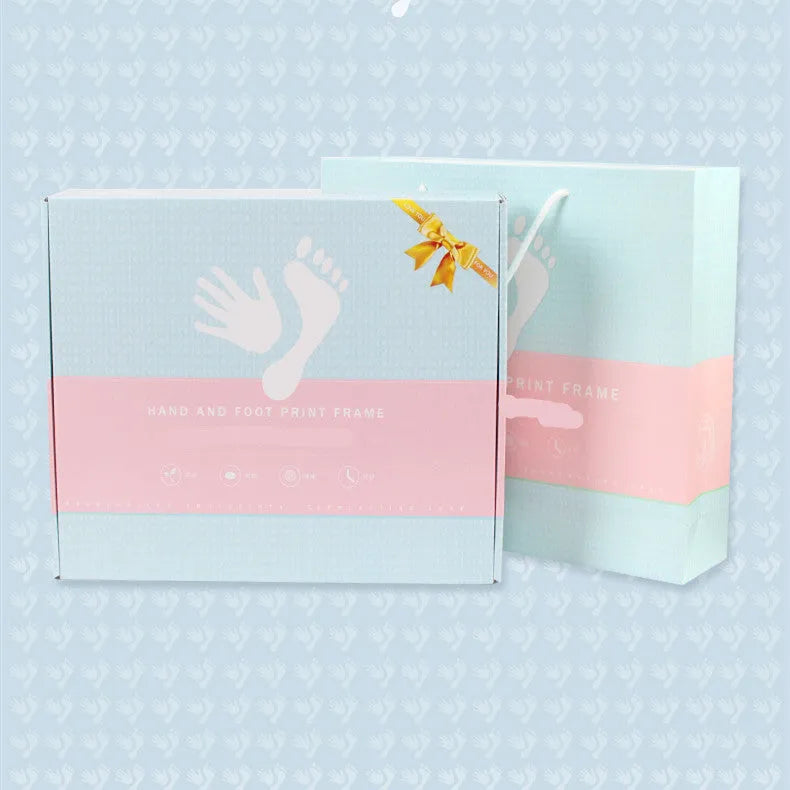Modern DIY baby hand and foot print photo frame with digital display post and warm light, in black, pink, or white finish.