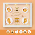 Modern DIY baby hand and foot print photo frame with digital display post and warm light, in black, pink, or white finish.