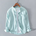 Fashion stand-up collar solid colour long-sleeved cotton linen blend shirt in black, shown on model