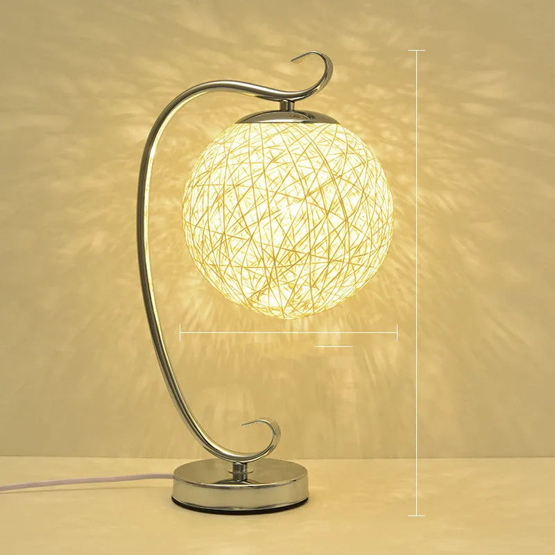 Small remote control dimmable LED table lamp with iron base and cloth shade in selected colour.