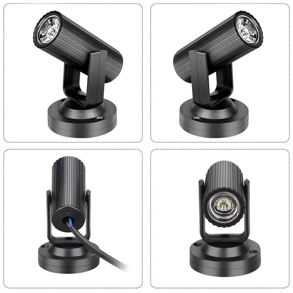 Black plastic 1W RGBW LED pinspot stage spotlight on a white background.