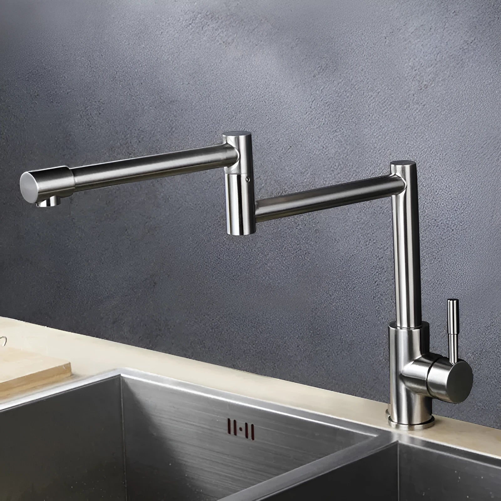 Silver stainless steel kitchen mixer tap with rotating spout and lift handle