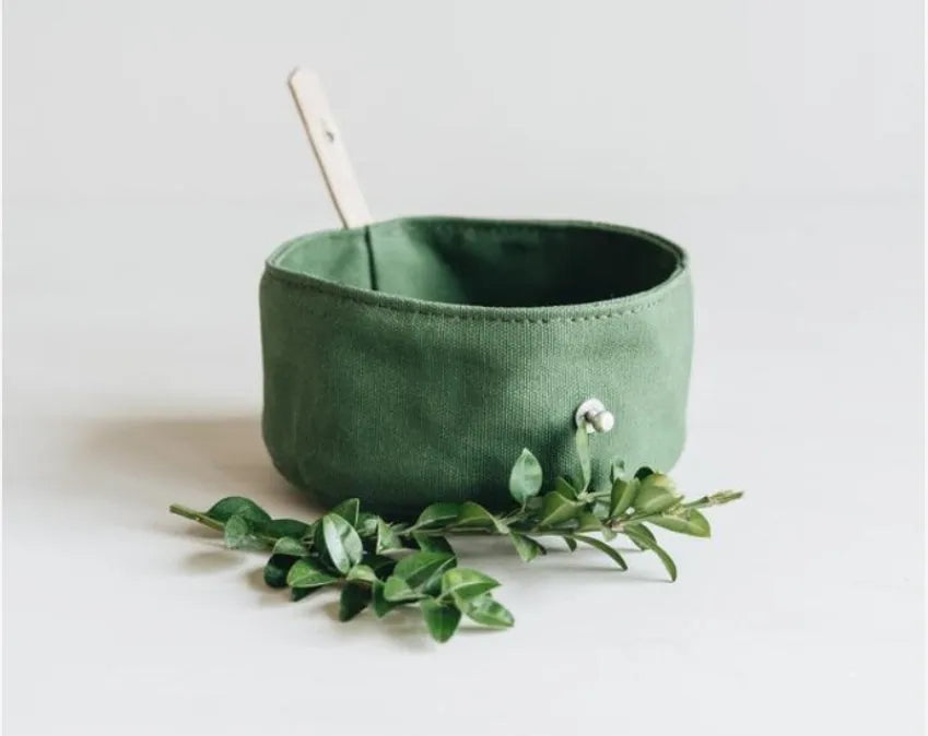 Folding canvas dog bowl in green, grey or yellow, 15cm diameter and 7.5cm high, for dry food or water.
