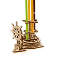 Ukrainian wooden rotating pen holder assembly kit showing photo colour finished model.