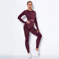 Woman wearing a seamless long-sleeved yoga suit in a neutral colour, demonstrating a stretch pose.