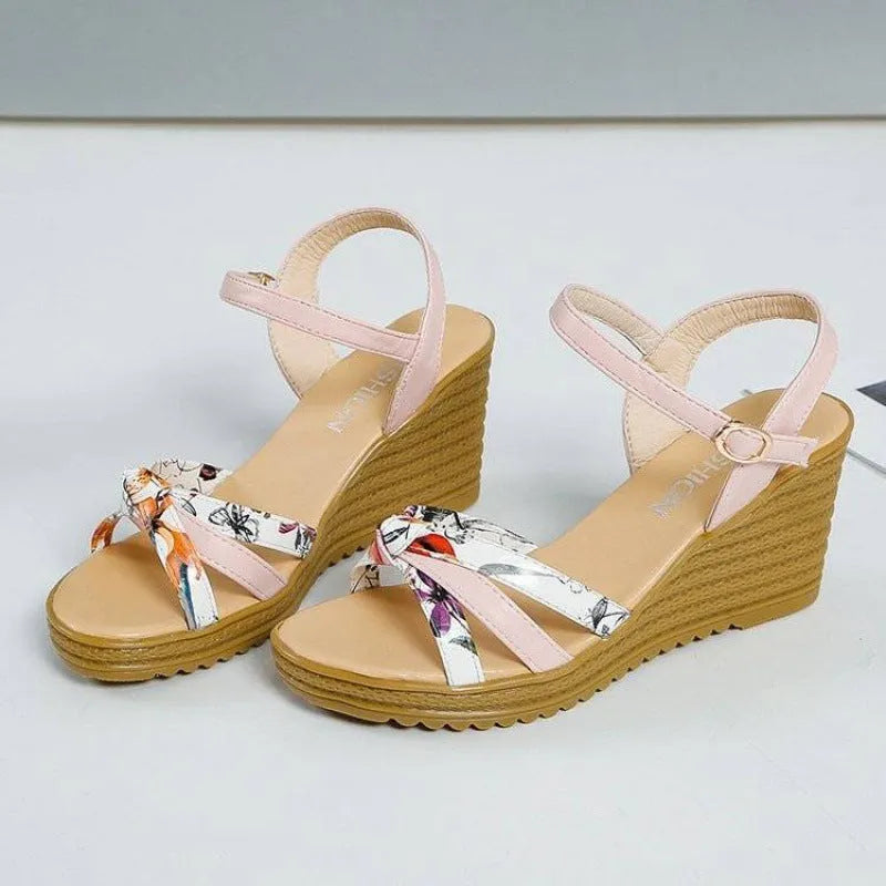 Women's pink PU wedge sandals with a thick heel, fish mouth design, and an adjustable buckle.