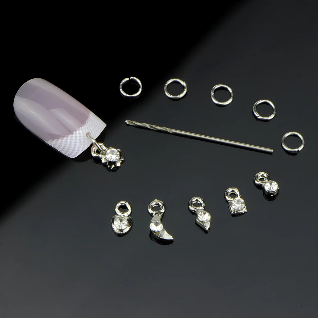 Set of two nail art straps in silver and gold alloy with shiny electroplated finish on a light background