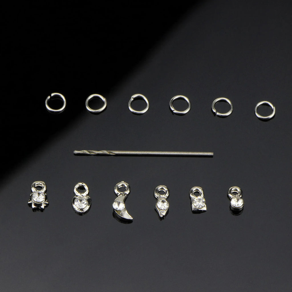 Set of two nail art straps in silver and gold alloy with shiny electroplated finish on a light background