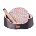 Four Seasons washable pet bed with sponge oval fossa in navy colour placed on floor