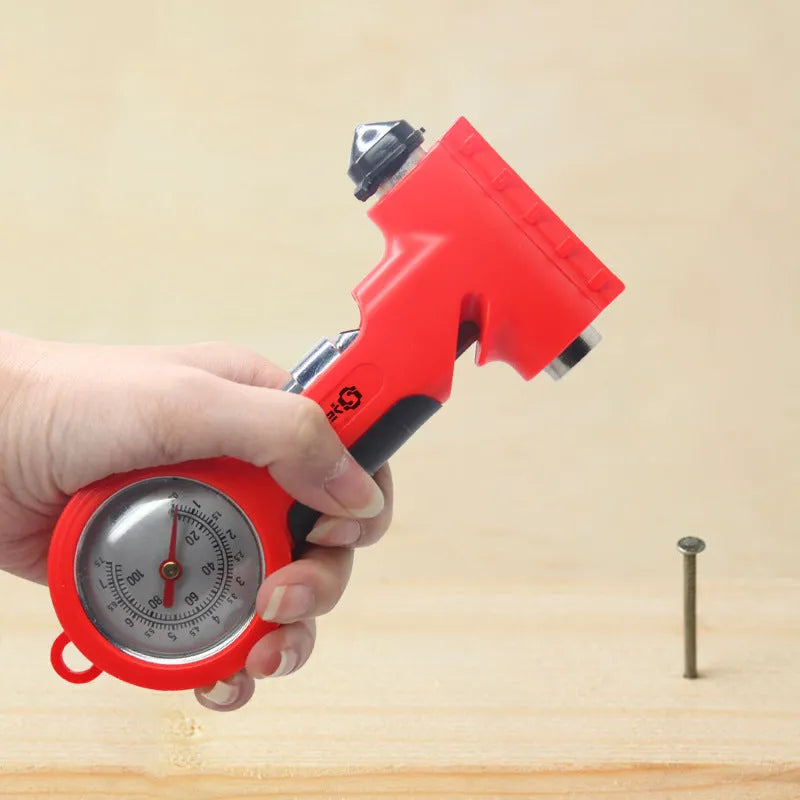 Red portable car tyre pressure gauge with integrated safety hammer, seat belt cutter, and snow shovel on a white background
