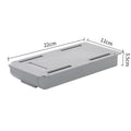 Grey plastic under table storage drawer box for organising stationery in a study.