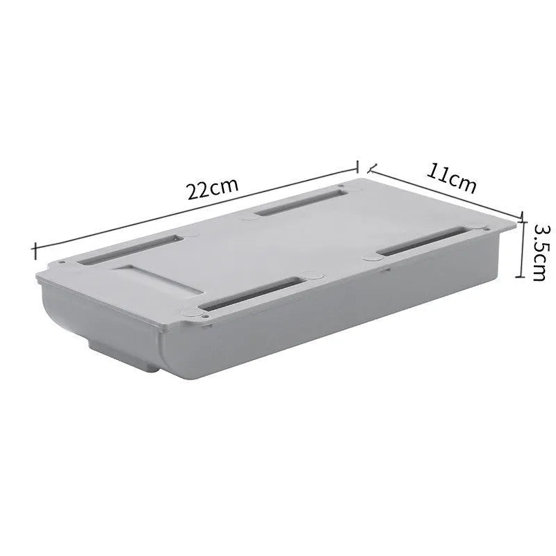 Grey plastic under table storage drawer box for organising stationery in a study.