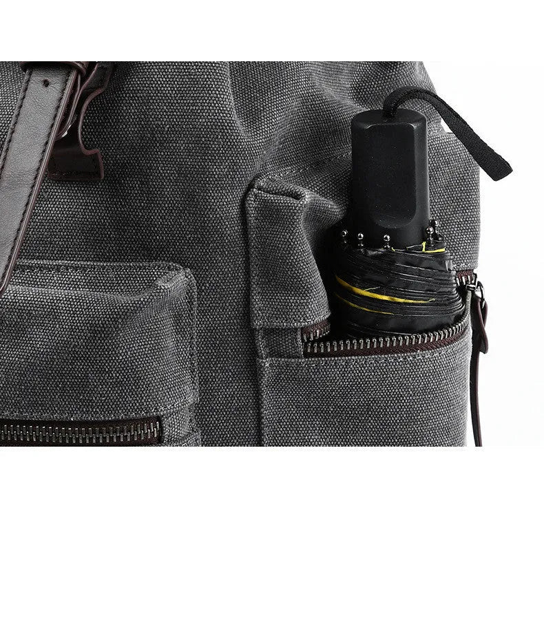 Men's retro canvas backpack in grey with colour-contrast design, large 20L capacity, soft handle, and zipper pocket