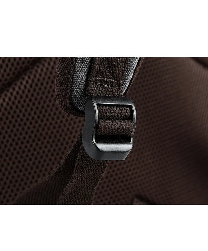 Men's retro canvas backpack in grey with colour-contrast design, large 20L capacity, soft handle, and zipper pocket