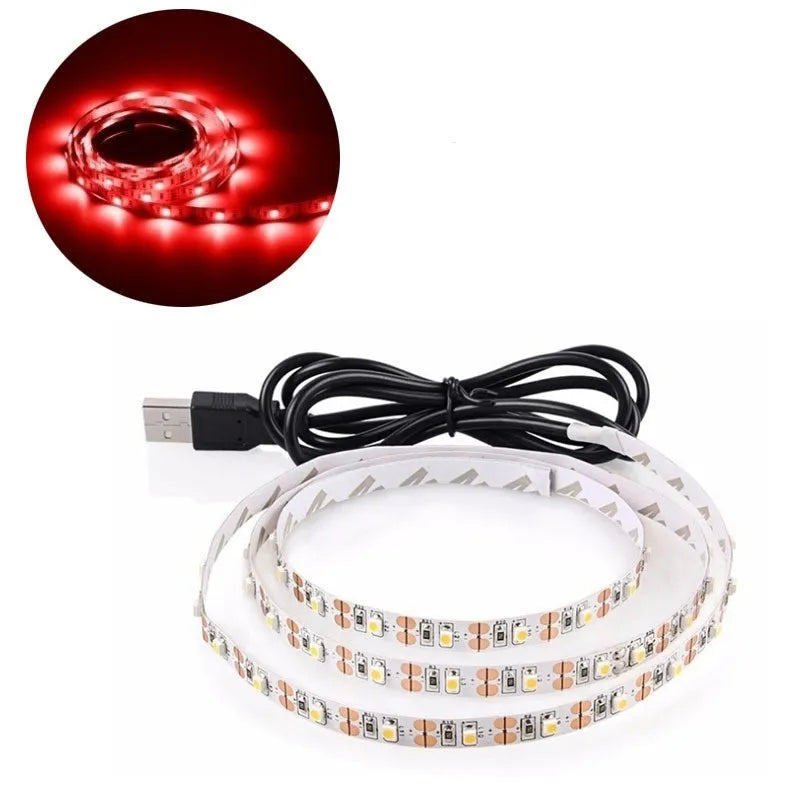 Flexible one-metre long USB LED light strip emitting blue light, coiled next to its USB power cable.