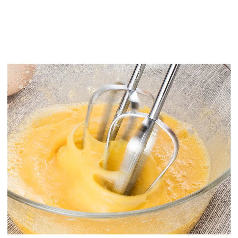 Small white automatic egg whisk 150W 7-speed handheld with three attachments on white background