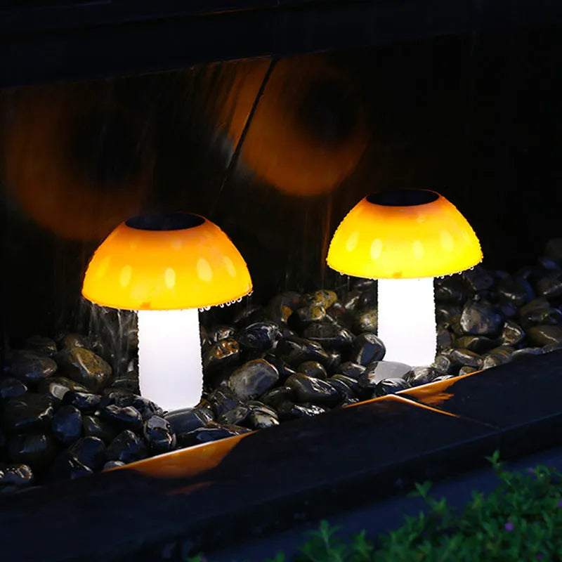Single solar-powered mushroom garden light with ground spike in white or warm light.
