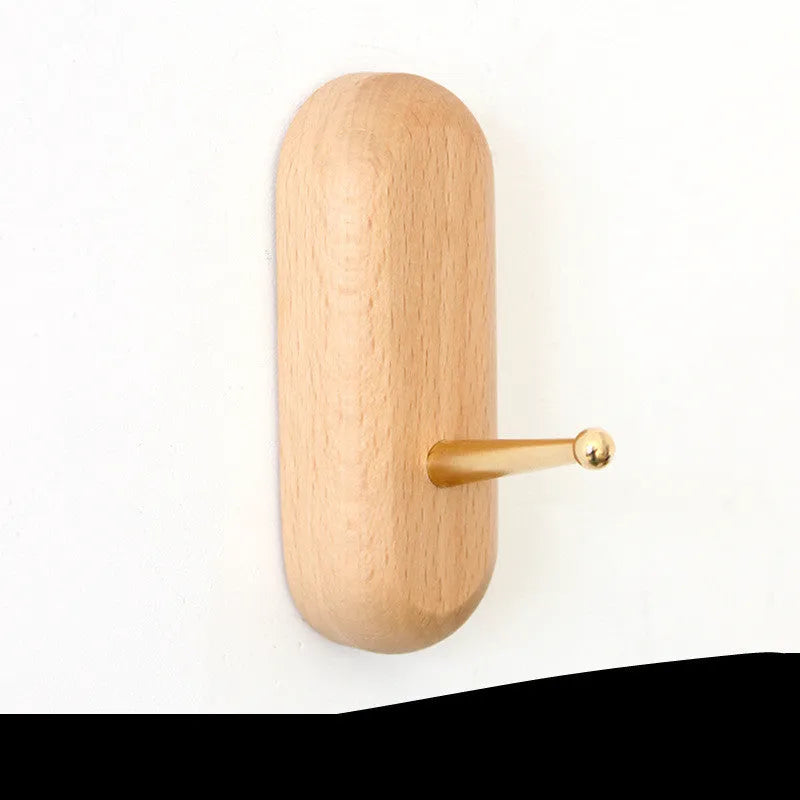 Beech wood adhesive wall hook in brass finish with 10kg capacity and geometric shape options