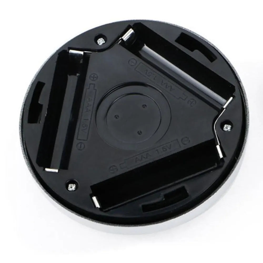 Silver circular battery-powered motion sensor night light with a white PC plastic lampshade.